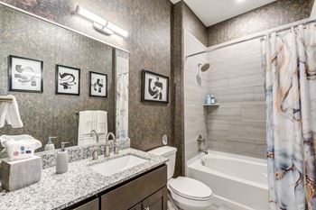 a bathroom with a sink toilet and bathtub